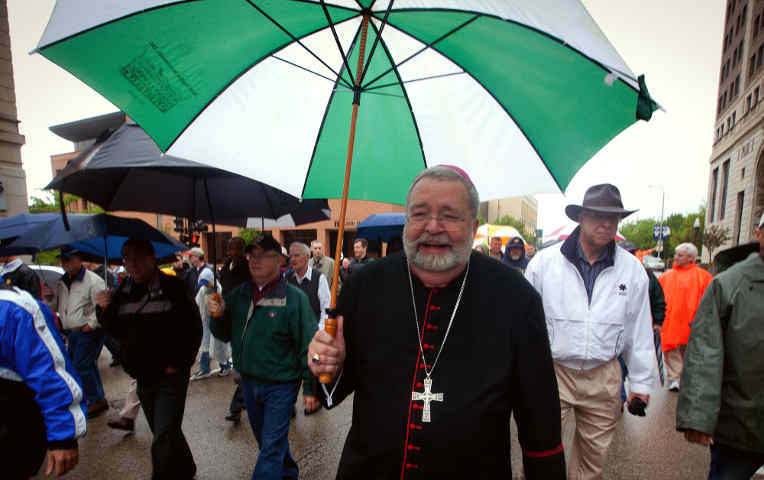 Bishop Daniel Jenky of Peoria, Ill., walks through downtown Peoria April 14 with more than 500 men during a "Call to Catholic Men of Faith" march shortly before preaching a sermon in which he compared President Obama to Hitler and Stalin. (CNS)