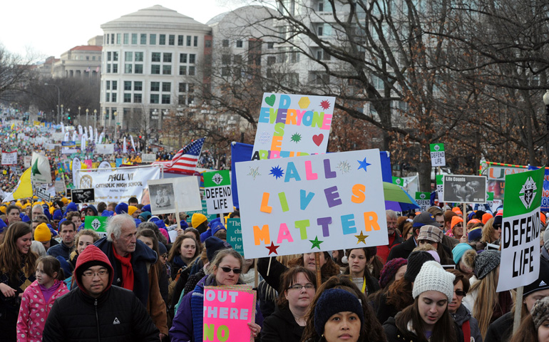 March for Life participants make their way up Constitution Avenue to the U.S. Supreme Court building Thursday in Washington. (CNS/Leslie E. Kossoff) 