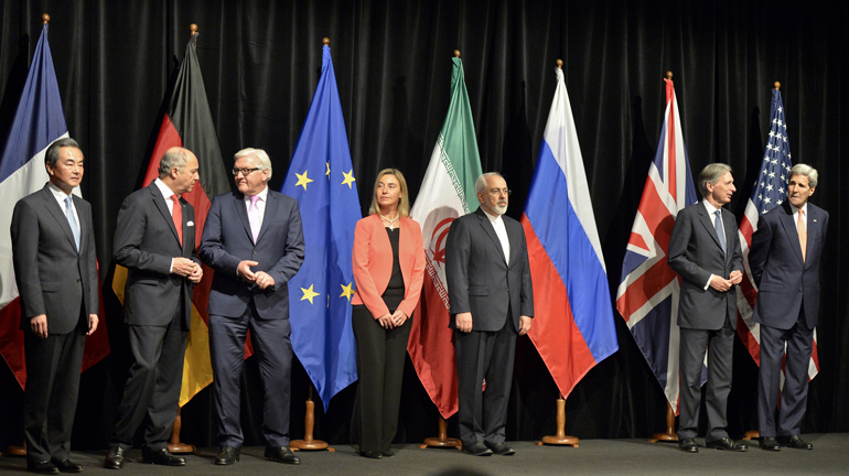 Chinese Foreign Minister Wang Yi; French Foreign Minister Laurent Fabius; German Foreign Minister Frank-Walter Steinmeier; Federica Mogherini, high representative of the European Union for foreign affairs and security policy; Iranian Foreign Minister Mohammad Javad Zarif; British Foreign Secretary Philip Hammond; and U.S. Secretary of State John Kerry at a press conference July 14 after reaching a nuclear deal (CNS/EPA/Herbert Neubauer)