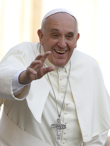 Pope Francis waves as he arrives to lead his general audience Wednesday in St. Peter's Square at the Vatican. (CNS/Paul Haring)