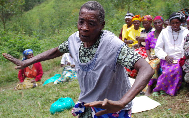 A Ugandan woman began dancing after receiving her first pair of shoes from parishioners of Our Lady Star of the Sea Parish in Bremerton, Wash. A delegation from the parish delivered school supplies and shoes to their sister parish during a visit in March 2015. (Cody Stinnett /Courtesy NWCatholic.org)