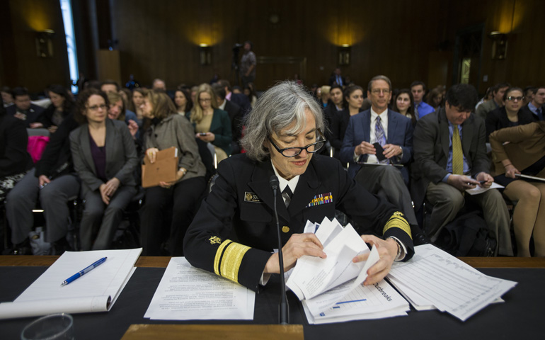 Dr. Anne Schuchat, director of the Centers for Disease Control and Prevention's National Center for Immunization and Respiratory Diseases, prepares to testify at a Senate hearing Tuesday in the Dirksen Senate Office Building in Washington. (CNS/EPA/Jim Lo Scalzo)