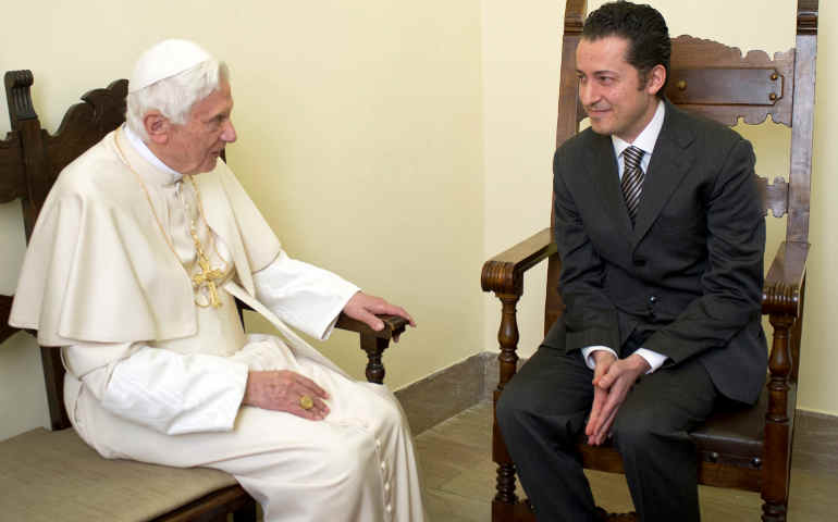 Pope Benedict XVI talks with former papal butler Paolo Gabriele during a private audience at the Vatican Dec. 22. (CNS/L'Osservatore Romano via Reuters)