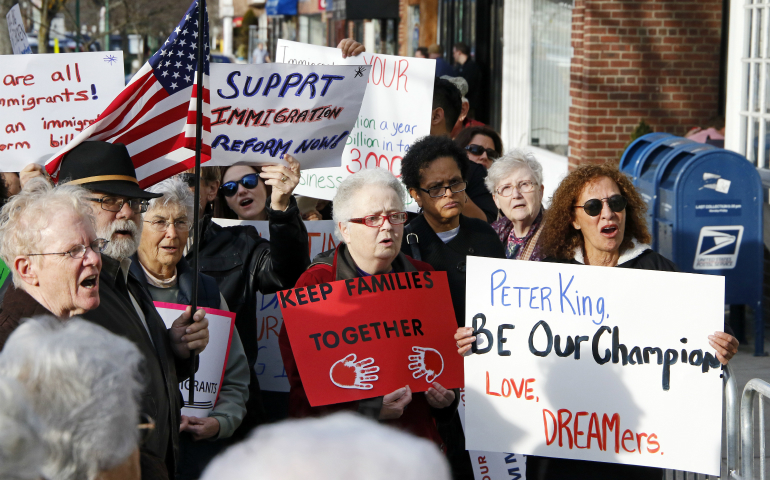 People gather at a rally in support of immigrants in Massapequa Park, N.Y., Feb. 24. The demonstration was held outside Republican Rep. Peter King's district office in an effort to urge the congressman to help protect unauthorized immigrants who currently have reprieve from deportation under the Deferred Action for Childhood Arrivals program, known as DACA. (CNS photo/Gregory A. Shemitz)