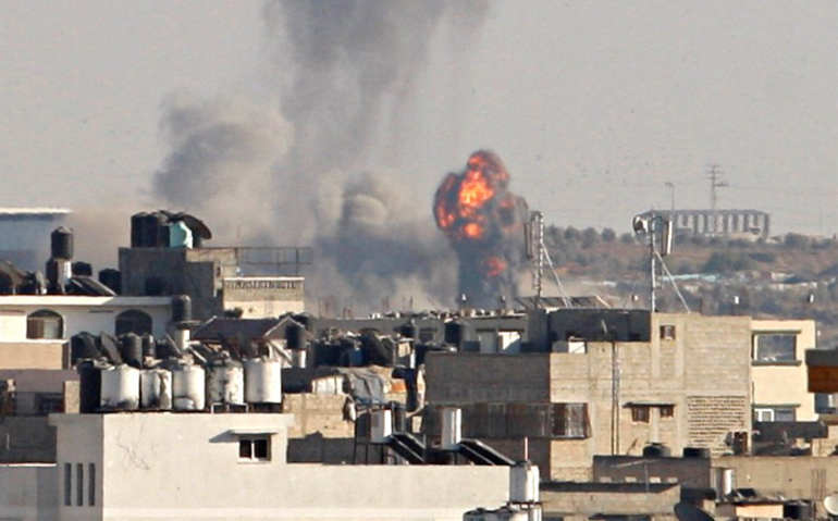 Smoke and flame are seen following what witnesses said was an Israeli air strike, east of Gaza City, Oct. 5. (Reuters/Ahmed Zakot)