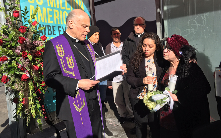 Archbishop Salvatore Cordileone leads a prayer service Jan. 27 in San Francisco's Tenderloin District for Gabriel Ramirez, who was killed Jan. 5; Alma Zamora, center, of the archdiocesan restorative justice office; and Grainne O'Brien, friend of Ramirez. (Rick DelVecchio/Catholic San Francisco)