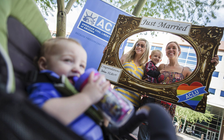 Angie Fincher and Darcy Fincher pose for a photo with their children after receiving their marriage license in Arizona on Oct. 17, the day a federal judge in Phoenix said same-sex marriage must be legal in the state. (CNS/Reuters/Deanna Dent)