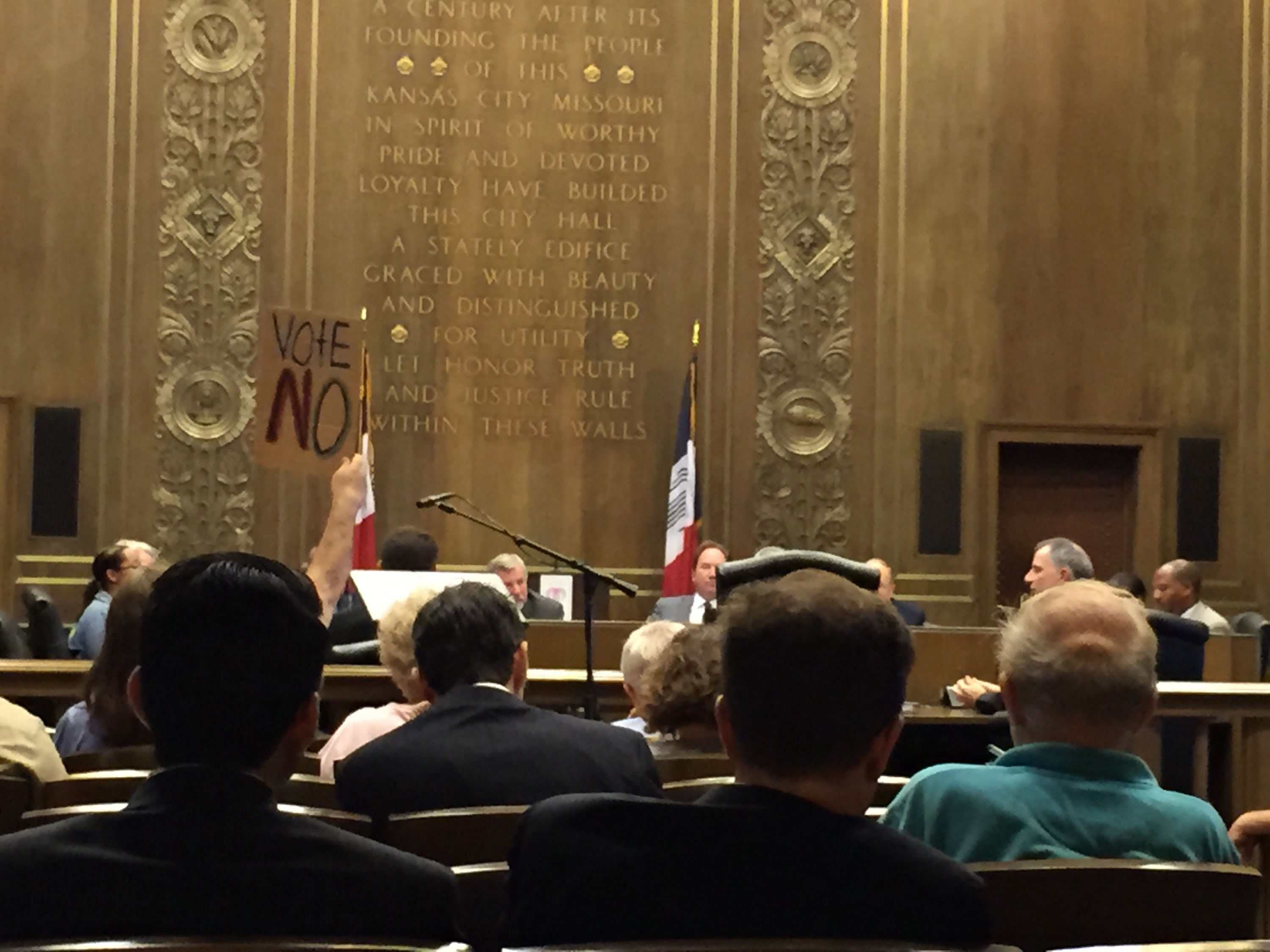 A parishioner from St. Francis Xavier protests testimonies at the city council's subcommittee hearing Wednesday in Kansas City, Mo. (NCR photo/Soli Salgado)