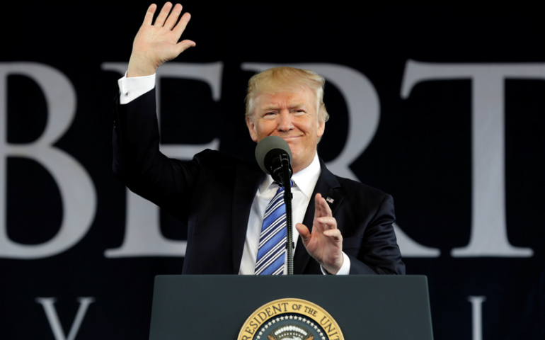 President Donald Trump waves before delivering keynote address at Liberty University's commencement in Lynchburg, Virginia, U.S., May 13, 2017. (Reuters/Yuri Gripas)