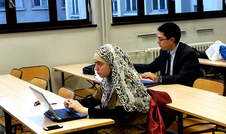 Students attend class at the Catholic University of Lyon, where the Bible dominates an evening lecture in Lyon, France. (RNS/ Elizabeth Bryant)