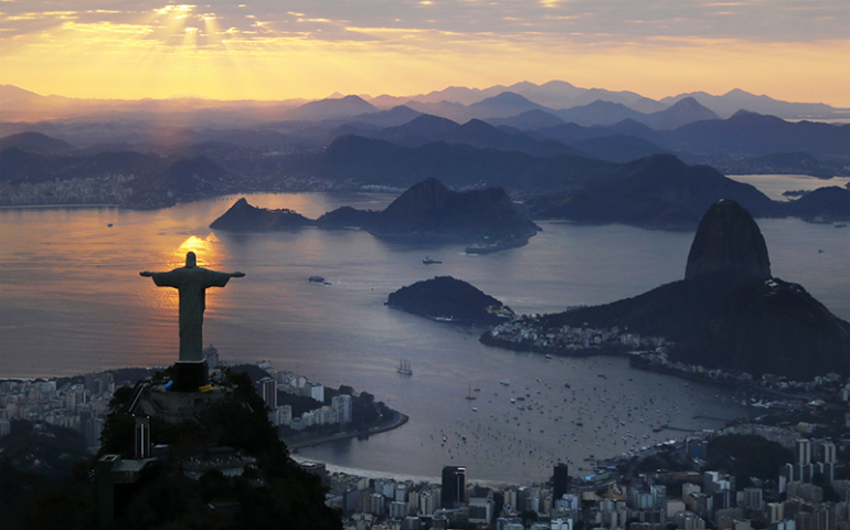 Rio de Janeiro's iconic Christ the Redeemer statue is seen at sunrise on Aug. 2, 2016. (Reuters/Wolfgang Rattay)