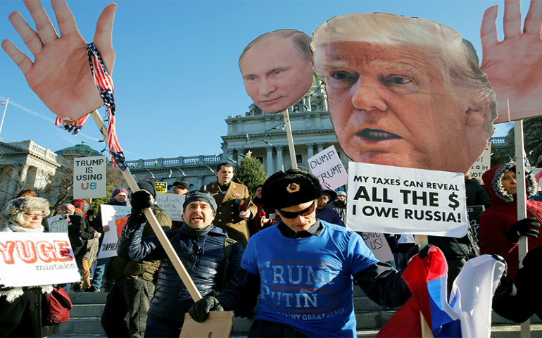 People protest against President-elect Donald Trump as electors gather to cast their votes for U.S. president at the Pennsylvania state Capitol in Harrisburg, Pa., on Dec. 19, 2016. (Reuters/Jonathan Ernst)