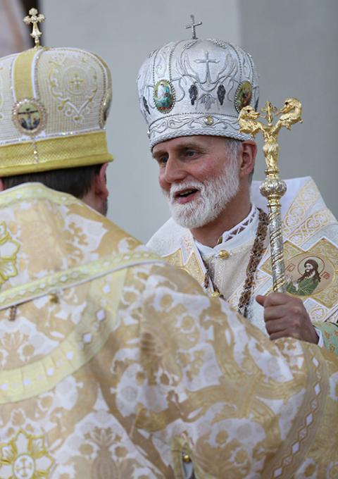 Archbishop Sviatoslav Shevchuk of Kiev-Halych, Ukraine, head of the Ukrainian Catholic Church, greets Metropolitan Archbishop Borys Gudziak after presenting him with his crosier.