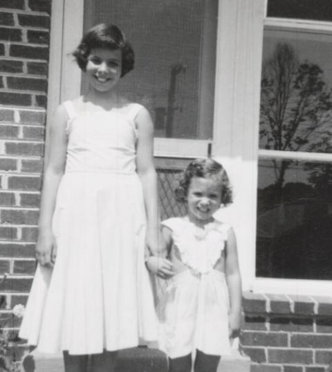 Nan Goldin, right, holds hands with her sister, Barbara. Goldin's sister died by suicide at 18. (Courtesy of Nan Goldin)