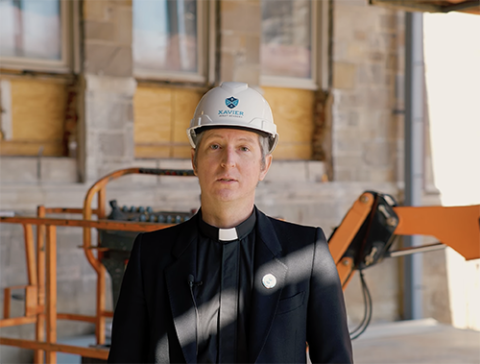Jesuit Fr. Nathan Wendt, president of Xavier Jesuit Academy, gives a video construction update. (NCR screenshot/YouTube/Xavier Jesuit Academy)