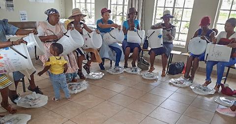 Sisters provide filters for breastfeeding mothers for access to clean water. (Agnes Motake)