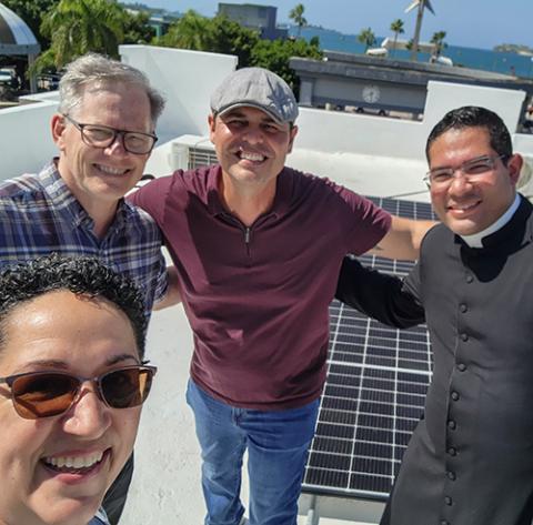 From left: Dominican Sr. Lissette Avilés-Ríos, Stewart Hudson from the Leon Lowenstein Foundation, David Ortiz of Solar United Neighbors, and parish priest Fr. José Gabriel Corazón launched the rooftop solar system at Nuestra Señora del Carmen Parish in Cataño, Puerto Rico. (Courtesy of Lissette A. Avilés-Ríos) 