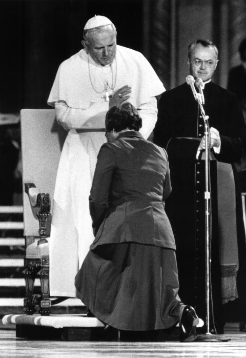 Mercy Sr. Theresa Kane, then president of the Leadership Conference of Women Religious, is blessed by St. John Paul II at the Basilica of the National Shrine of the Immaculate Conception in Washington during the pope's 1979 visit to the U.S. Kane, earlier in the service, had challenged the pope to include women in all ministries of the church. She died at age 87 Aug. 22, 2024. (OSV News/CNS file)