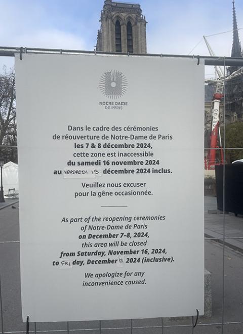 A sign is seen near Notre Dame Cathedral on Dec. 1. (NCR photo/Christopher White) 