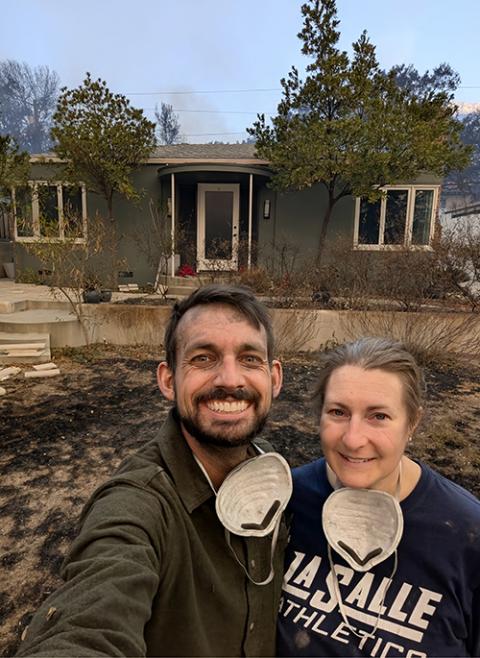 Nick and Timithie Norman take a selfie in front of their home. They worked with others to save their home and others in their neighborhood Jan. 8 in Altadena, California. (Courtesy of Nick Norman)