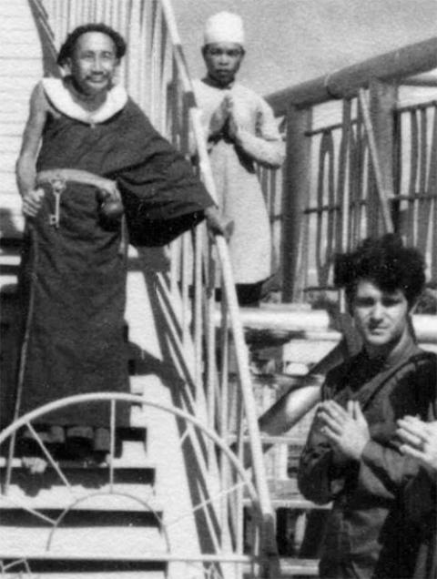 Tom Fox shows respect to a Daoist monk in the Mekong Delta circa 1969. The monk, known as the Coconut Monk, lived exclusively on coconuts and water and sought an end to the war by having all Vietnamese come together in peace. (Courtesy of Thomas C. Fox)