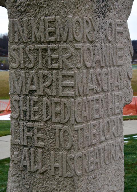 The inscription on the back of the statue donated to the Cleveland Ursulines by the family of Sr. Joanne Marie Mascha after her murder says she dedicated her life to God and his creatures.  (GSR photo/Dan Stockman)