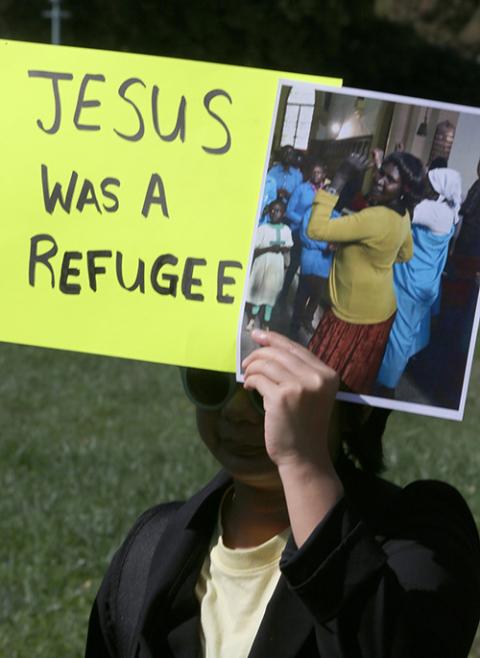 A protester holds up a sign Oct. 15, 2019, outside the U.S. Capitol in Washington against the first Trump administration's cuts in the number of refugees to be admitted under the U.S. resettlement program. The U.S. bishops Feb. 18 sued the second Trump administration for its abrupt halt to funds for resettling refugees. (OSV News/CNS/Bob Roller)