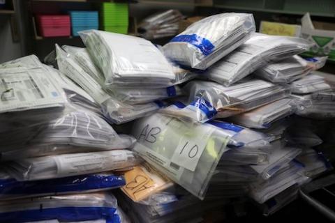 Completed absentee ballots are piled in the ballot room after Election Day at the Kenosha Municipal Building in Kenosha, Wisconsin, Nov. 4. (CNS/Reuters/Daniel Acker)