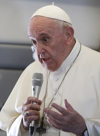 Pope Francis aboard papal plane