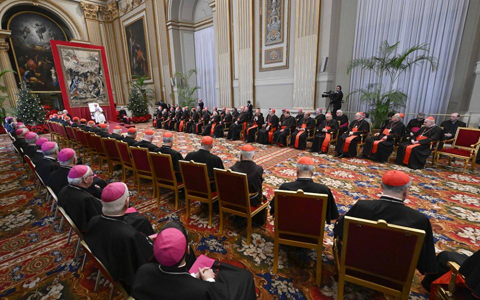 Pope Francis speaks to cardinals and top officials of the Roman Curia in the Vatican's Hall of Blessings Dec. 21, 2023. In his traditional pre-Christmas speech, the pope focused on the need for Curia officials to learn to listen and discern as they help the church move forward. (CNS/Vatican Media)