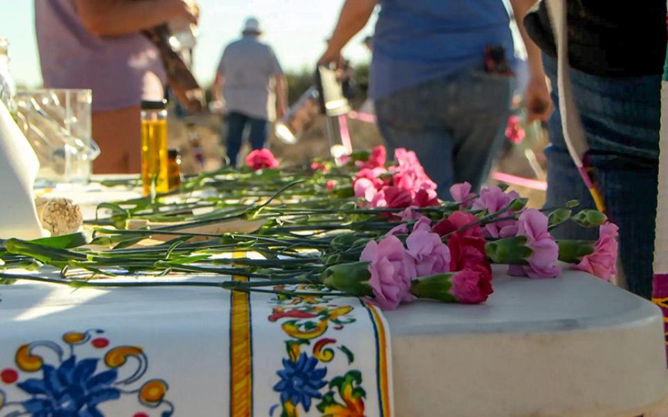 Interfaith clergy prepare an altar in the desert to honor those who have died without names or identification in the desert in Santa Teresa, New Mexico. (KTSM/Jesus Baltazar)