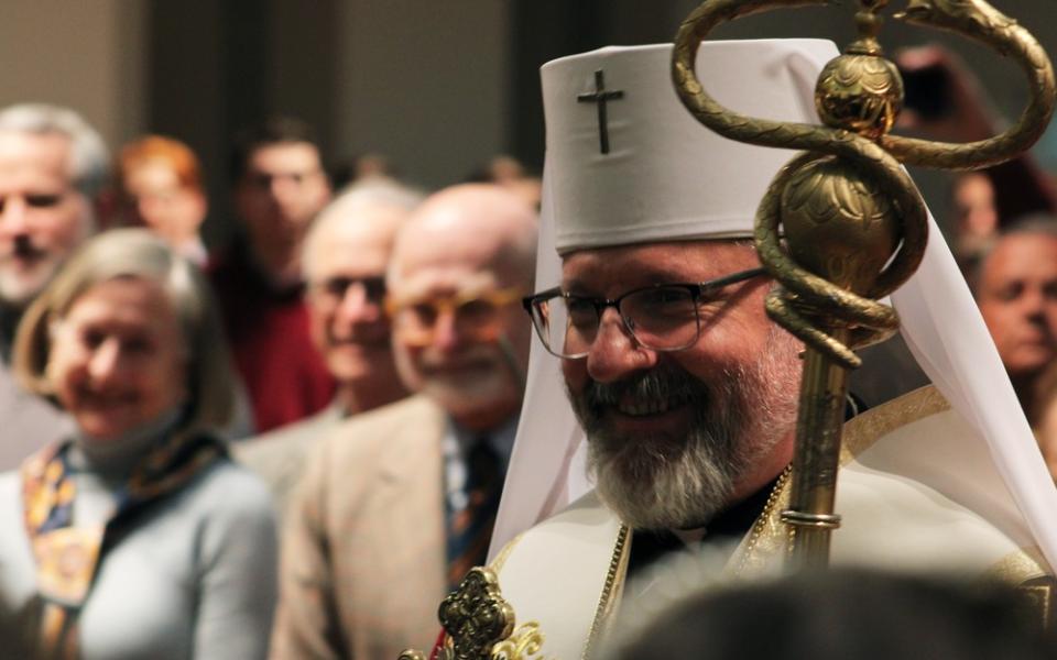 The bishop wears Greek vestments and carries staff.