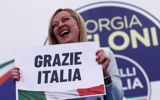 Giorgia Meloni, leader of Brothers of Italy, holds a sign at the party's election night headquarters in Rome Sept. 26. Italian voters handed a victory to a coalition of center-right parties and set the stage for Meloni to become the next prime minister. 