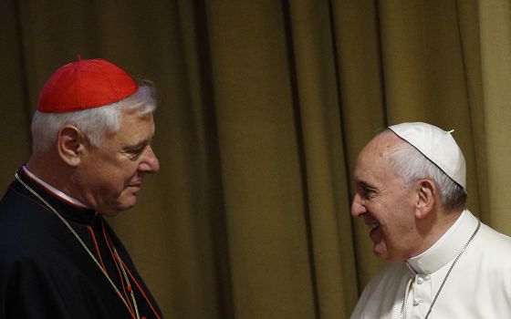 Cardinal Gerhard Müller, then-prefect of the Congregation for the Doctrine of the Faith, greets Pope Francis before the morning session of the extraordinary Synod of Bishops on the family Oct. 13, 2014, at the Vatican. (CNS/Paul Haring)