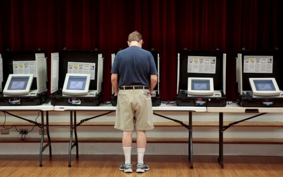 A man casts his vote at Holy Cross Catholic Church in Tucker, Georgia, in a 2017 special election. (CNS/Reuters/Chris Aluka Berry)