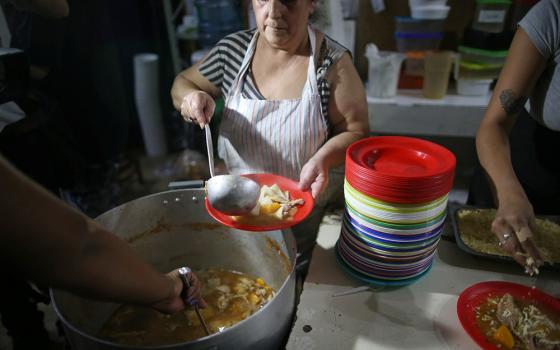 Women prepare food at a soup kitchen April 3, 2019, in Buenos Aires, Argentina. (CNS/Reuters/Agustin Marcarian)