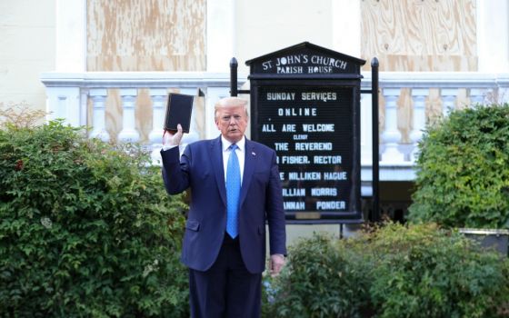 President Donald Trump holds a Bible as he stands in front of St. John's Episcopal Church in Washington June 1. (CNS/Reuters/Tom Brenner)