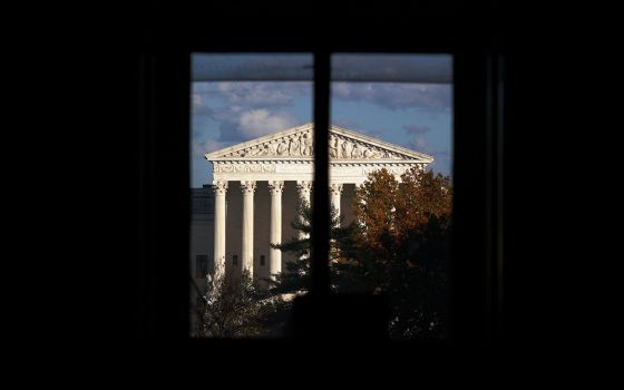 The Supreme Court building is seen through a window Nov. 10 in Washington. (CNS/Hannah McKay, Reuters)