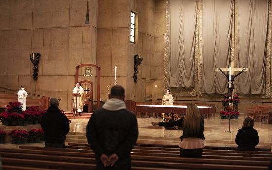 Archbishop José Gomez of Los Angeles, president of the U.S. Conference of Catholic Bishops, celebrates Christmas Eve Mass Dec. 24, 2020, at the Cathedral of Our Lady of the Angels in Los Angeles. (CNS/Victor Alemán, Angelus News)