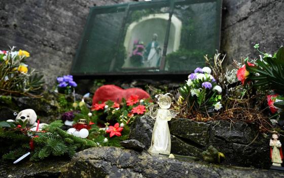 An angel and statue of Mary are pictured at a cemetery in Tuam, Ireland, where the bodies of nearly 800 infants were uncovered at the site of a former Catholic home for unmarried mothers and their children. The photo was taken Jan. 12, the day a commissio