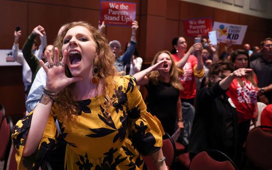 Angry parents and community members in Ashburn, Virginia, protest after the Loudoun County School Board halted its meeting because the crowd refused to quiet down June 22. Many at the meeting objected to "critical race theory" being part of the curriculum