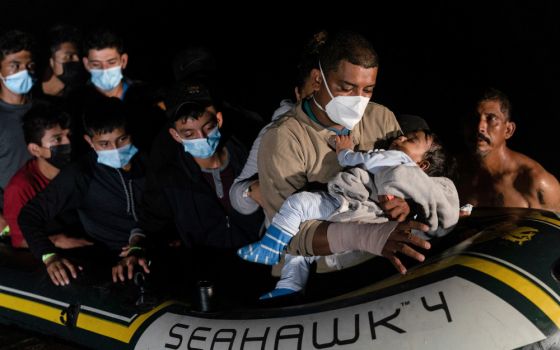 Migrant families arrive Aug. 14 in Roma, Texas, after crossing the Rio Grande from Mexico amid the coronavirus pandemic. (CNS/Reuters/Go Nakamura)