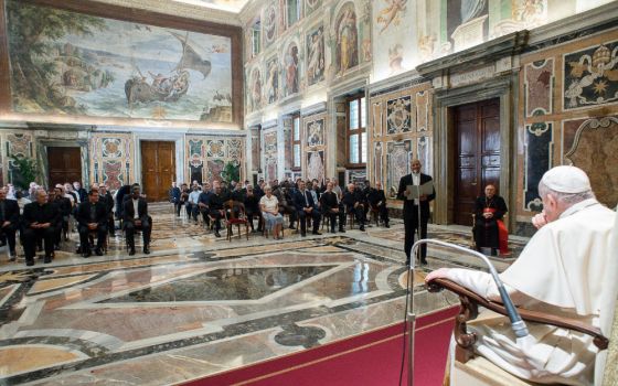 Pope Francis listens as Fr. Mathew Vattamattam, superior general of the Claretian Missionaries, speaks during an audience with members of the order at the Vatican Sept. 9. (CNS/Vatican Media)