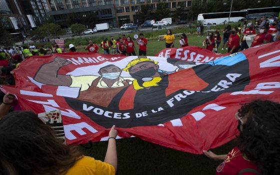 Migrant families and immigration advocates in Washington call for a pathway toward U.S. citizenship as they gather near Benjamin Banneker Park to march toward the U.S. Immigration and Customs Enforcement building Sept. 21, 2021. (CNS photo/Tyler Orsburn)