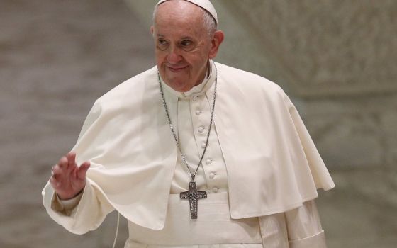 Pope Francis greets the crowd as he arrives for his general audience in the Paul VI hall at the Vatican Sept. 29. Pope Francis will not be attending the U.N. Climate Change Conference in Glasgow, Scotland, in November; Cardinal Pietro Parolin will head th