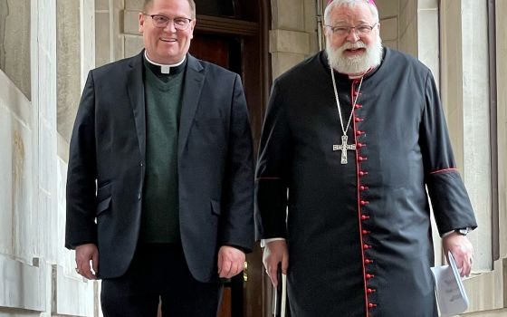 Coadjutor Bishop Louis Tylka, left, and Bishop Daniel R. Jenky are seen at St. Mary's Cathedral in Peoria, Ill., Feb. 23, 2022. Pope Francis accepted the resignation of Bishop Jenky March 3, 2022, and as coadjutor, Bishop Tylka immediately succeeds him as