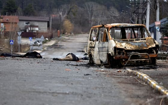 Bodies of civilians who, according to residents, were killed by Russian soldiers, lie on the street in Bucha, Ukraine, April 2, 2022.