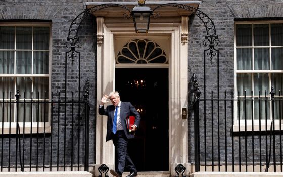 British Prime Minister Boris Johnson walks at Downing Street in London July 6. The following day, he resigned as prime minister. (CNS/Reuters/John Sibley)