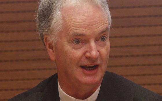 Bishop Paul Tighe speaks during a conference at the Vatican in 2019. (CNS/Robert Duncan)