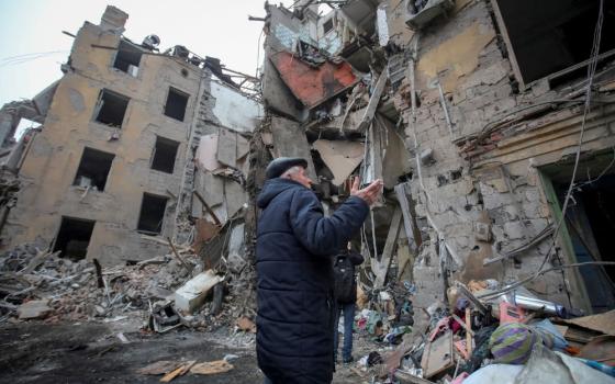 A local resident gestures outside a residential building in Kramatorsk, Ukraine, Feb. 2, 2022, which was destroyed by a Russian missile strike. (OSV News/Reuters/Vyacheslav Madiyevskyy)